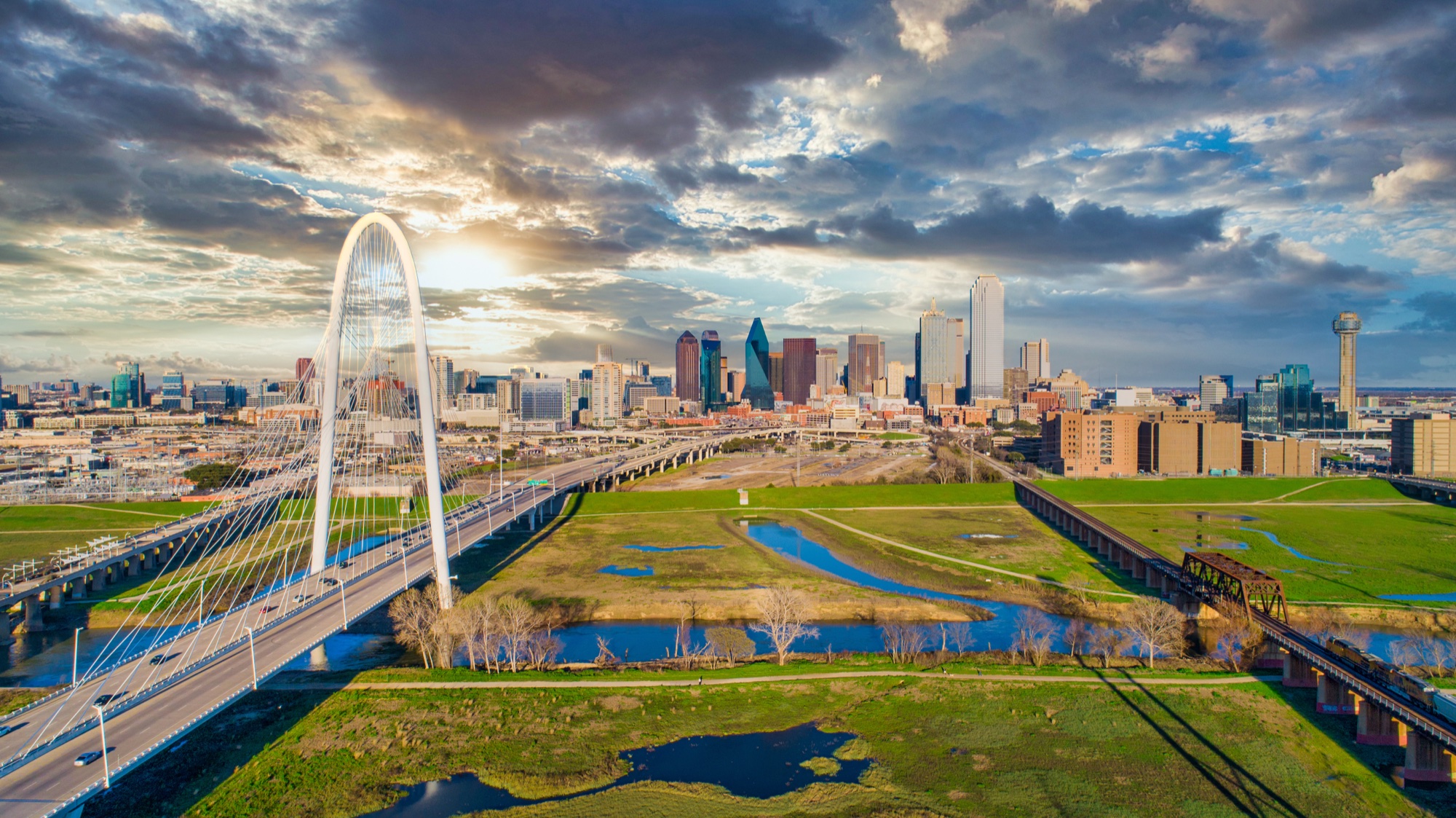Dallas downtown skyline with the Margaret Hunt Hill Bridge over the Trinity River